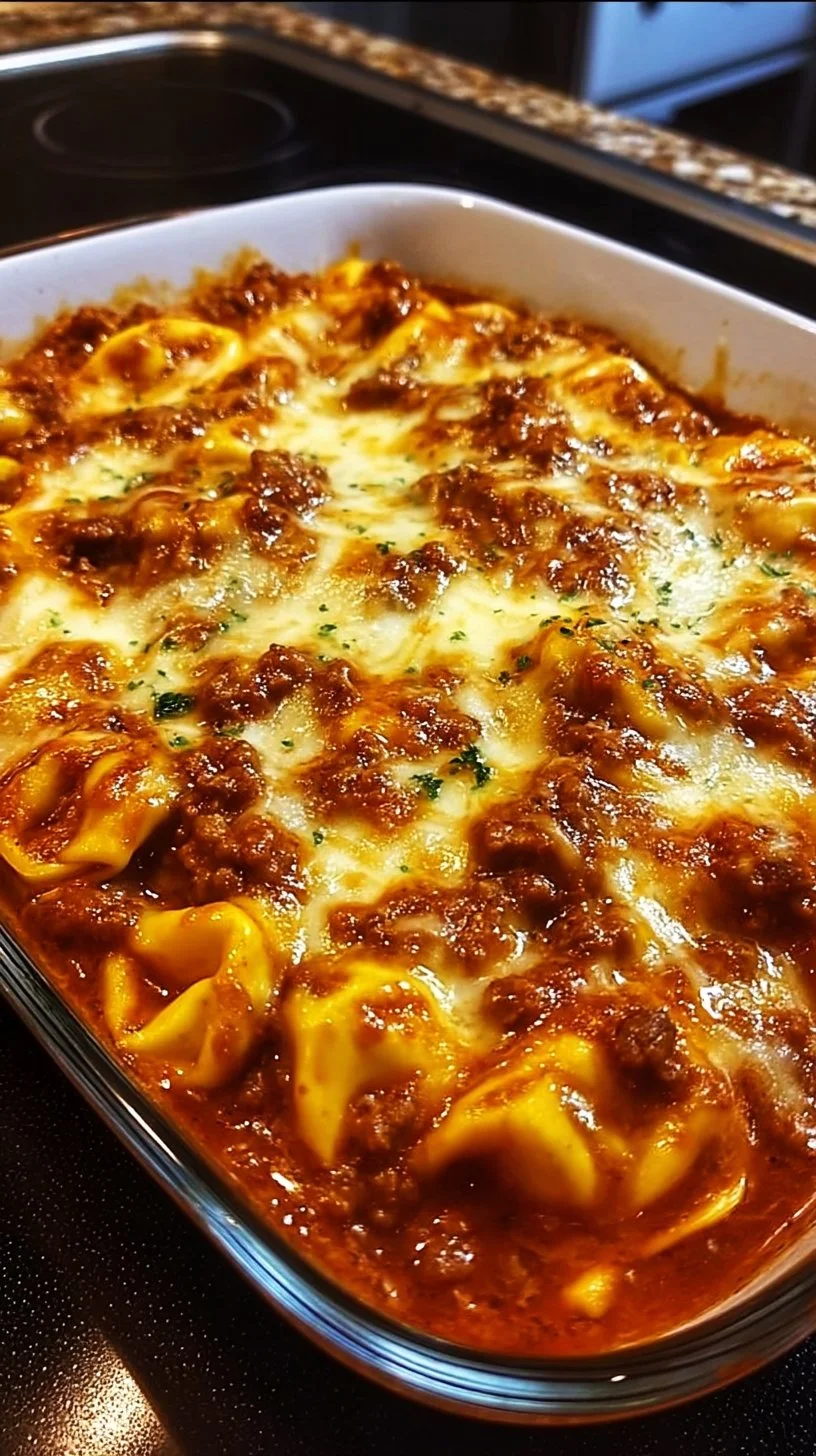 Cheesy beef tortellini enchilada bake served in a casserole dish