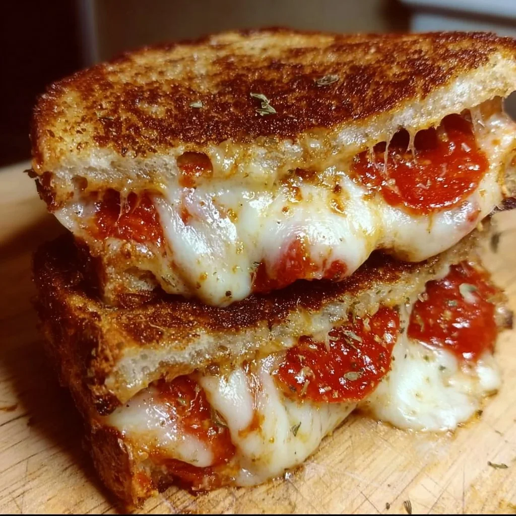 Delicious Pizza Grilled Cheese Sandwiches melting cheese and pepperoni on toasted bread